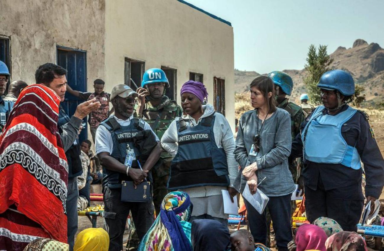 UN Volunteer William Joof (second from the left), facilitating a UN Sanctions Committee’s security assessment visit to Dorsa, controlled by the Sudan Liberation Movement/Army (SLA), in Central Darfur.