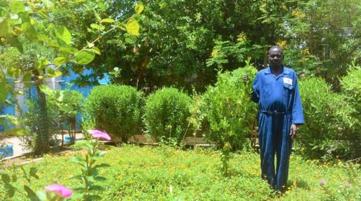 Mukhtar Ahmed stands in the garden he tends at UNHCR’s field office in El Geneina, West Darfur